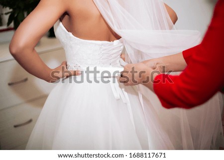 morning bride on her wedding day, blonde in white dress.