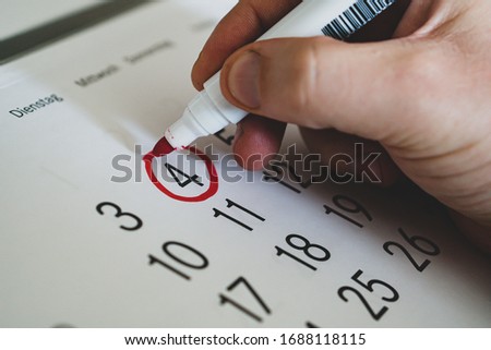 Calendar marks date with orange marker.Business meeting appointment date Royalty-Free Stock Photo #1688118115