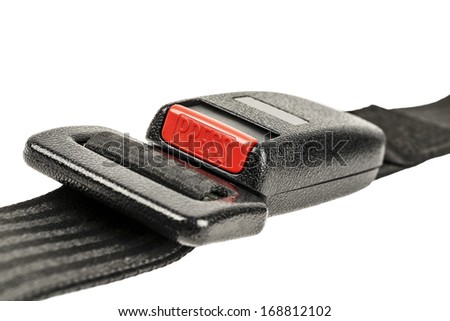 Car safety belt with buckle fastened shown close up on white background
