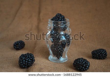 Deluxe blackberries on natural background. Close up, top view, high resolution product. Harvest Concept