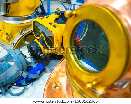 Equipment for scuba diving. Industrial diving. Deep dive. Different types of diving helmets. Belonging to the submariner. Equipment for descents under water.