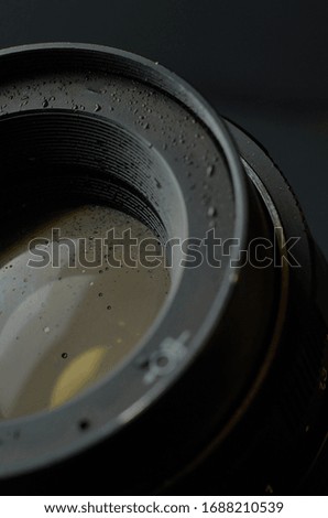 object close up with or without water drops on a dark background with highlights