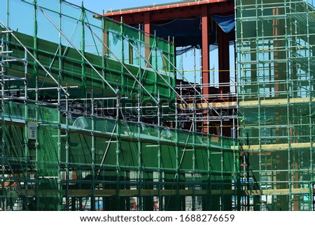 It is a vertical net set up on a construction site.