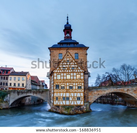 Famous Old City Hall of Bamberg on the river Regnitz in the morning hours in Bavaria / Germany. Picture was taken in the blue hour before sunrise