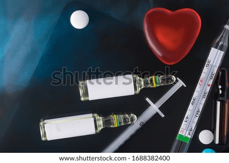 concept of dietary supplements and red heart on x-ray background