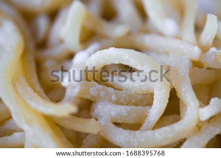 Spoiled spaghetti with mold. Pasta or noodles with white penicillum spores. Old food close up background