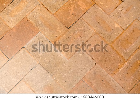 Vintage floor tiles in yellow and orange. As a background or for design.