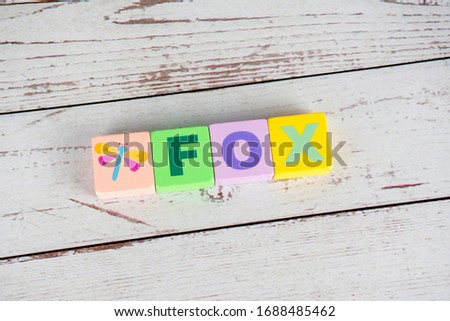 Fox word on wooden cubes. Fox concept， A background image of english words on colorful blocks