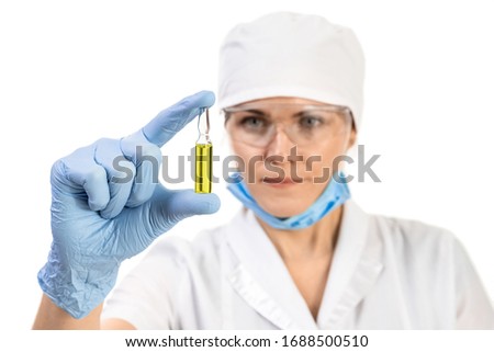 A doctor or scientist in laboratory holding ampoule vaccines for children or older adults, or cure animal diseases. Concept: diseases, medical care, science, anesthesia, euthanasia, diabetes.