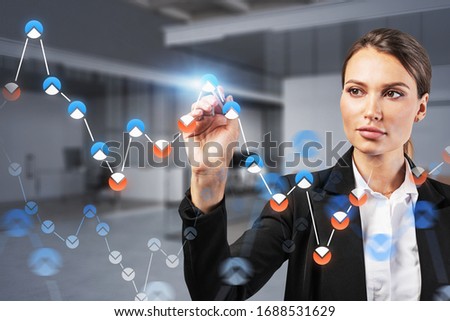 Beautiful young businesswoman working with digital financial graph in blurry office. Concept of stock market and technology. Toned image double exposure