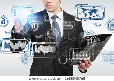 Unrecognizable European businessman with clipboard working with futuristic HUD business interface over blurry gray background. Concept of hi tech in business. Toned image