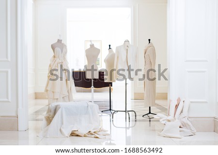 Sartorial mannequin and designer dress in showroom  Royalty-Free Stock Photo #1688563492