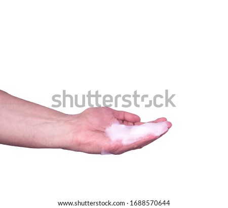  man's hand in foam isolated on a white background. washing hands close up. concept of chiston and hyena. virus prevention