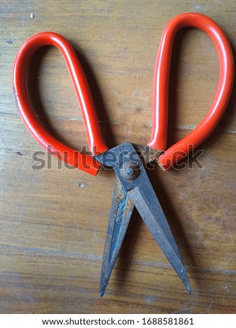 scissors red plastic handles open closed