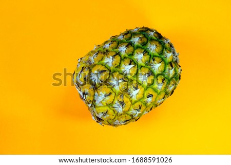 a ripe pineapple show in the plain background from the tropical zone