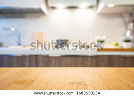 Wooden table top on blur kitchen room background.
For displaying the assembly product or visual arrangement of the configuration keys Royalty-Free Stock Photo #1688630134