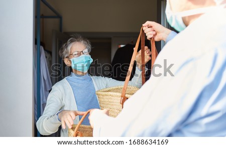 Grocery delivery service for elderly in quarantine at Covid-19 Coronavirus epidemic Royalty-Free Stock Photo #1688634169