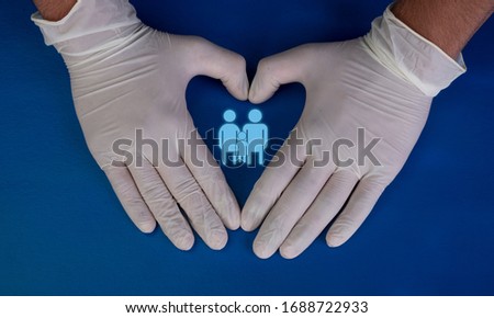 Protect your family from corona virus with gloves on blue background, cleaning environment