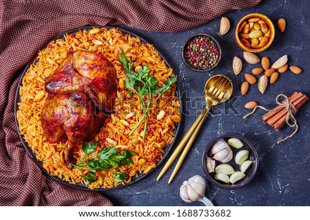Chicken kabsa - homemade arabian rice, top view Royalty-Free Stock Photo #1688733682