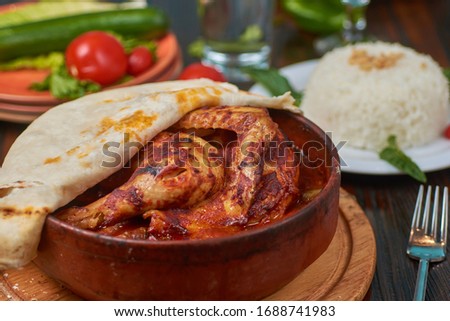 Chicken in clay with saj bread, rice and vegetables