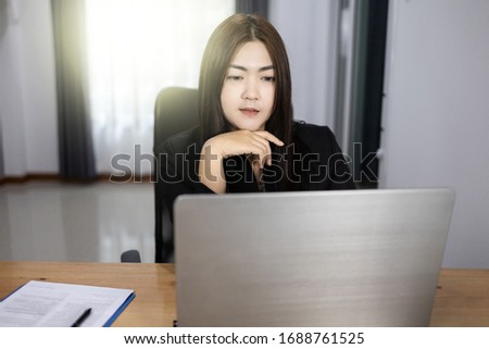 Work form home concept, Bussiness woman working discussing the charts. Asian woman.