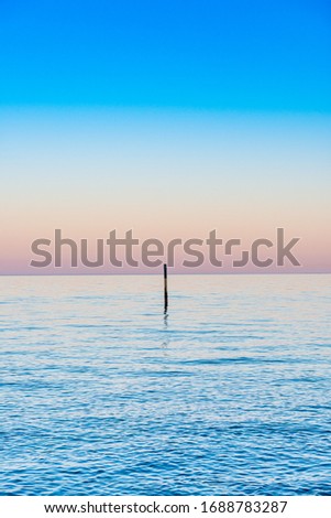 Sunset on the coast of the island of Rugen. Vertical.