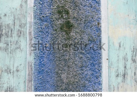Old blue damaged wall. Color abstract grunge background.