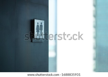 Restroom sign on the wall a toilet sign man and woman WC signs