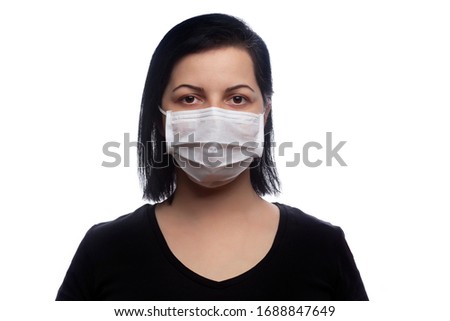 Woman wearing a white mask