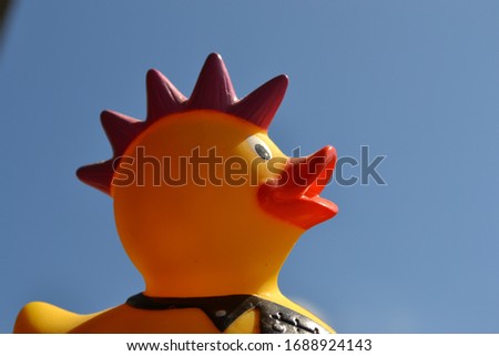 rubber duck toy against the sky