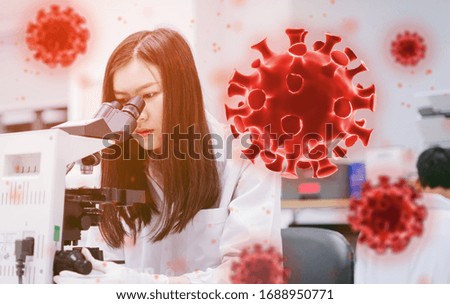 young female medical  scientist looking at microscope and corona virus background in medical laboratory 