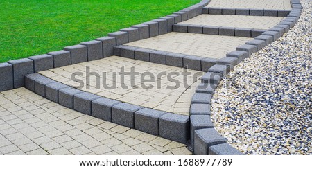 Flat external stairs Garden stairs made of concrete block paving Royalty-Free Stock Photo #1688977789