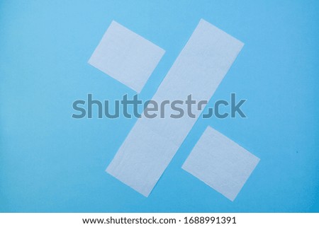 White toilet paper percentage sign on a blue background