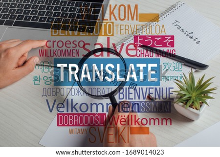 cropped view of translator working with hieroglyphics, laptop and magnifying glass, welcome translation illustration