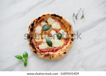 pizza napoli olive oil mozzarella tomato Royalty-Free Stock Photo #1689045409