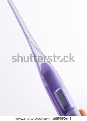  purple thermometer isolated stock image.