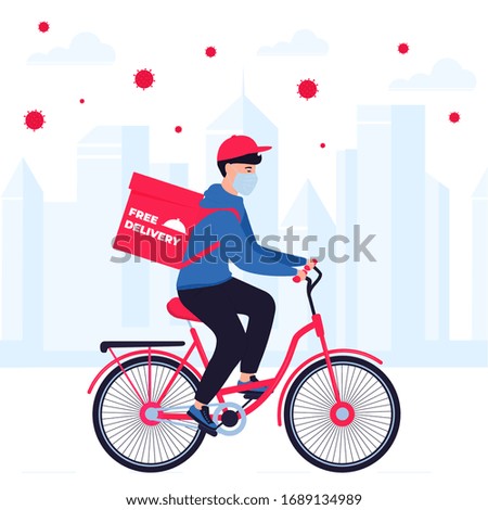 COVID-19. Quarantine in the city. Coronavirus epidemic. Delivery man in a protective mask carries food on a bicycle. Free shipping