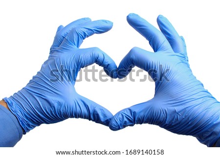 Hands in medical gloves depict a heart on a white background, isolated. The concept of excellent treatment results