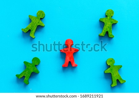 Tolerance, social protection, anti-discrimination concept. Wooden human figures on blue table, top view