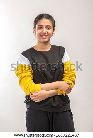 portrait of a confident and cheerful indian teenager girl