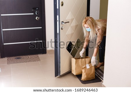 Quarantine or self isolated family receiving food to door Royalty-Free Stock Photo #1689246463