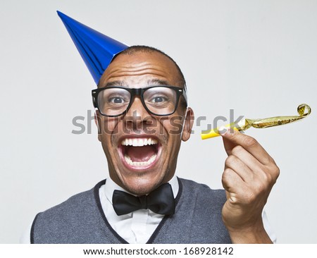Male geek ready to celebrate for New Years, Christmas or any celebration Royalty-Free Stock Photo #168928142