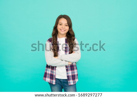 Living happy life. Good mood concept. Positive vibes. Sincere emotions. Cute girl with long hair. Small girl checkered shirt. Happy international childrens day. Little girl turquoise background.