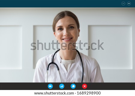 Headshot portrait screen application view of smiling female nurse talking on video call with sick patient at home, happy woman doctor or GP consult client online using Web conference on computer Royalty-Free Stock Photo #1689298900
