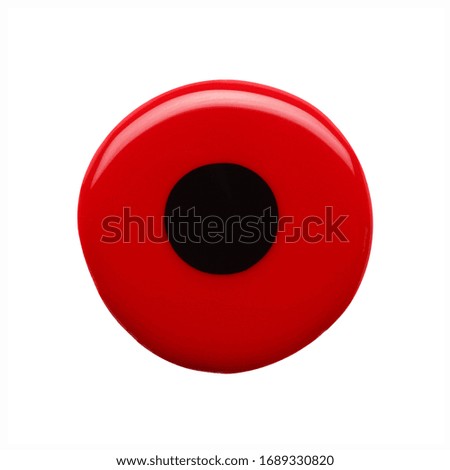 Blot of red black nail polish shaped circle isolated on white background. Photo. Top view