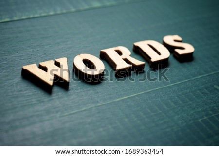 Words text on a wood table.