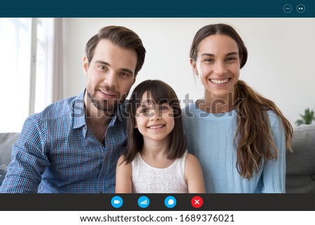 Headshot portrait screen application view of smiling young family with little daughter speak talk on video call with relatives, happy parents with small kid chat online use Web conference on laptop Royalty-Free Stock Photo #1689376021
