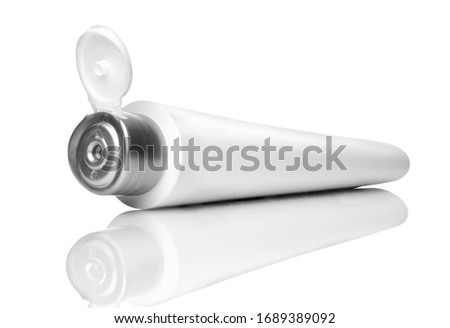 Open white tube for cream, toothpaste, gel or for cosmetics. Isolated on white.