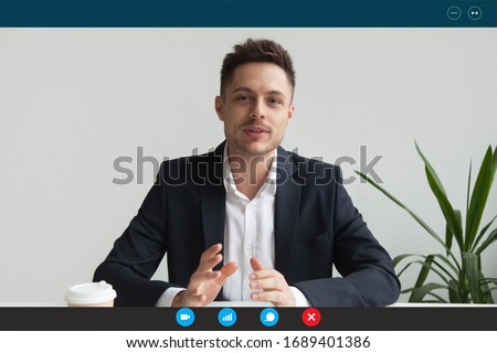 Headshot portrait screen application view of male employee have online interview using Web conference on computer, young businessman speak talk on video call on laptop with partner from home Royalty-Free Stock Photo #1689401386