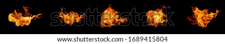 Fire flames on a black background abstract. Royalty-Free Stock Photo #1689415804
